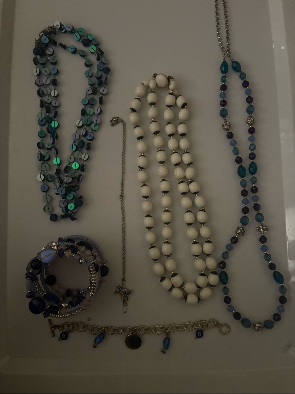 Handcrafted White and Blue Beaded Bracelet Stack with necklaces in jar